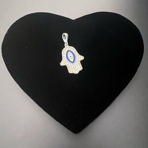 Silver pendant , evil eye